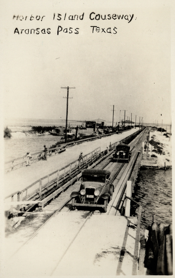 Automobiles on Aransas Harbor Terminal Ry.'s auto toll road, ca. 1930's. 