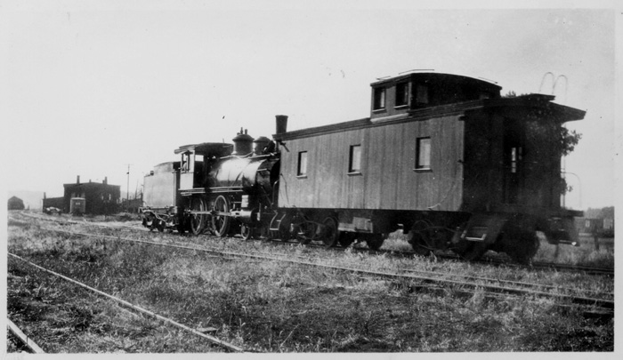 Atlantic Northern Ry. locomotive no. 2 moving a caboose in the Atlantic, Iowa yards. 