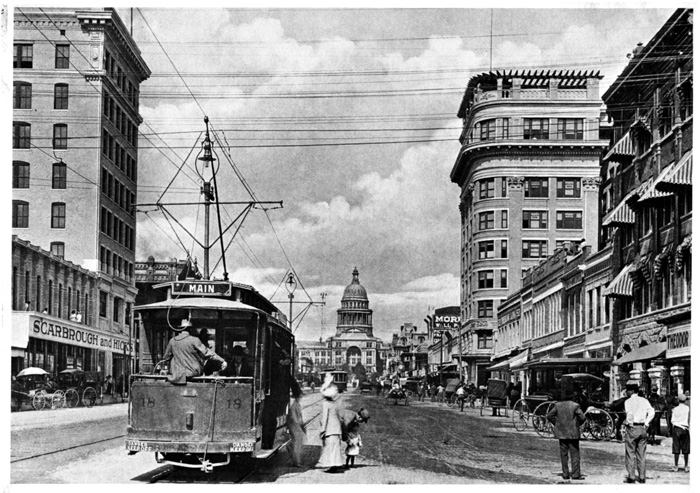 Austin Street Ry. car no. 18 loading passengers on Congress Avenue, looking toward the capitol building, circa 1900. 