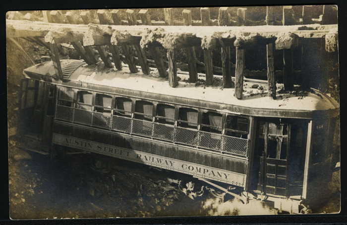 Austin Street Ry. bridge and streetcar destroyed by flood waters on April 22, 1915. 